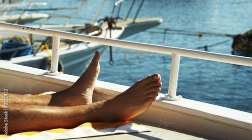 Leinwandbild Motiv mans legs on yacht