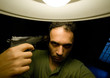 man commiting suicide shooting in his head