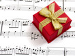 gift box on music sheet gift box on music sheet