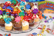 platter of cupcakes decorated with happy birthday theme
