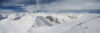 high snow mountains under cloudy sky