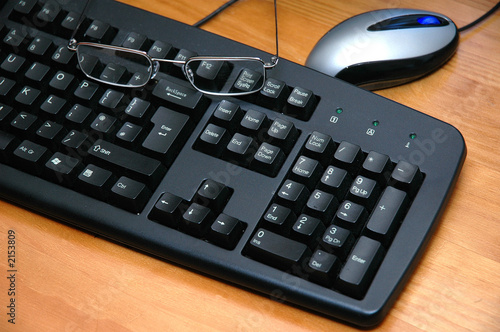 Photo: mouse,glasses and keyboard mouse,glasses and keyboard