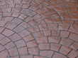 the wet sidewalk.