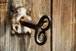 old house key in wooden doors. old house key in wooden doors.