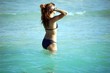 young girl in a black bikini