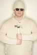 man smiles with hammer