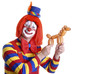 Photo: smiling clown holding a balloon animal smiling clown holding a balloon animal