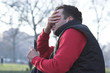 anxious man holding a mobile phone