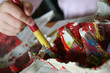 child with paint brush