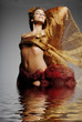 artistic beautiful woman in water