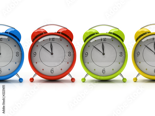 four colourful alarm clocks isolated on white background 3d four colourful alarm clocks isolated on white background 3d