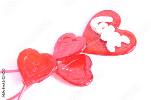 Foto: red lollipops in shape of heart red lollipops in shape of heart