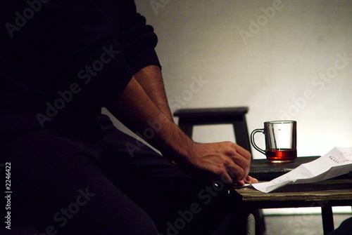 writer and a glass of tea