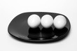 boiled eggs on  black plate