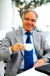 older businessman on a break with his laptop