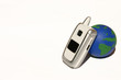 white mobile cell phone with a globe on a white ba white mobile cell phone with a globe on a white ba
