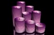 3d illustration of candles on a black background