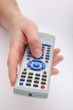 hand with remote control