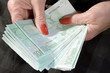 businesswoman counting her money