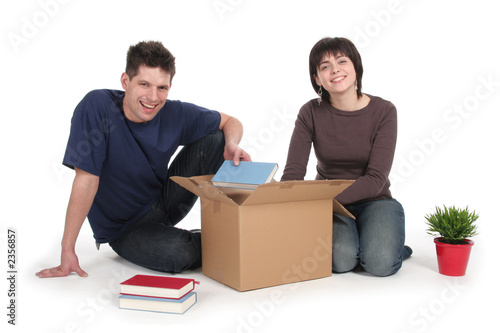 couple unpacking boxes
