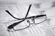 glasses on a newspaper glasses on a newspaper