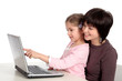 mother and daughter using laptop
