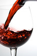 wine pouring into glass from decanter