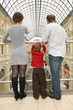 behind family with child in shop
