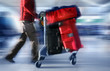 man with red bags at the airport