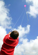 child flying kite.