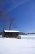 cabin on frozen lake