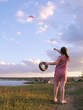 a girl flying a comet