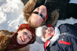 winter family lies on snow