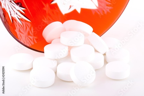 Photo: pills and red glass pills and red glass