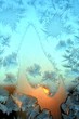 winter pattern on window. sunset