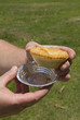 meat pie from australia in mens hand with foil meat pie from australia in mens hand with foil