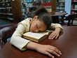 girl sleeping in the library