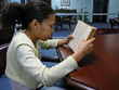 child reading in the library