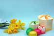 easter eggs, gift boxes and daffodils