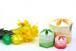 easter eggs, gift boxes and daffodils