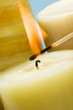 lighting candle with match