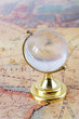 glass globe and old map