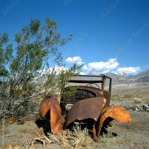 old and rusty car in the desert