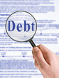 word debt, magnifying glass in hand