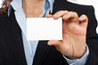business woman holding one blank card business woman holding one blank card