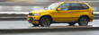 yellow suv x5 luxury german car, driving fast