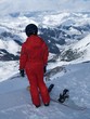 a snowboarder watching a valley a snowboarder watching a valley