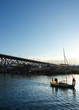 small boat sails down harbour