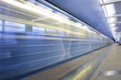 Subway station, moving train