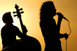 a singer and a stand up base silhouette
